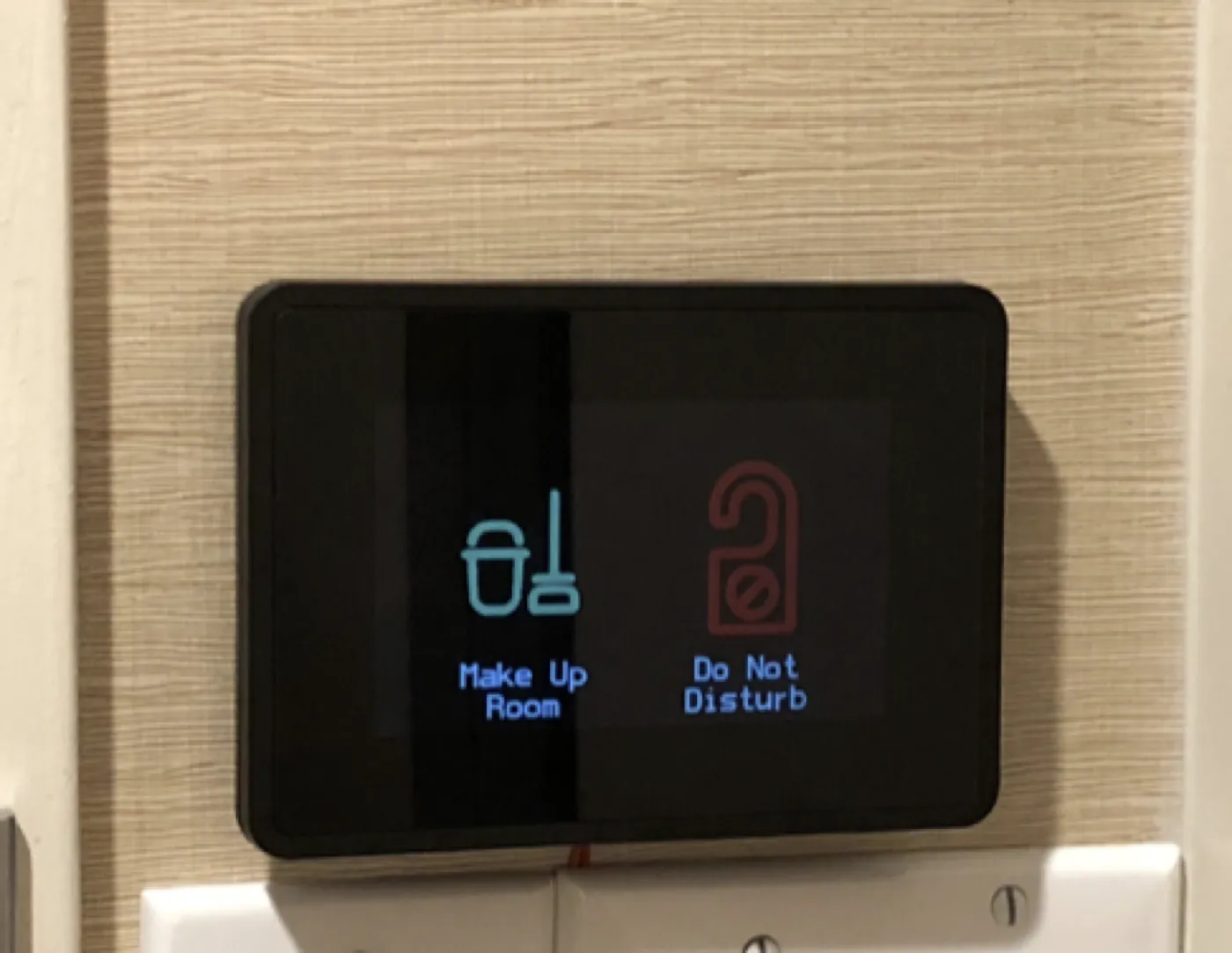 Interior GridRabbit DnD and Make Up Room touch screen installed by the door