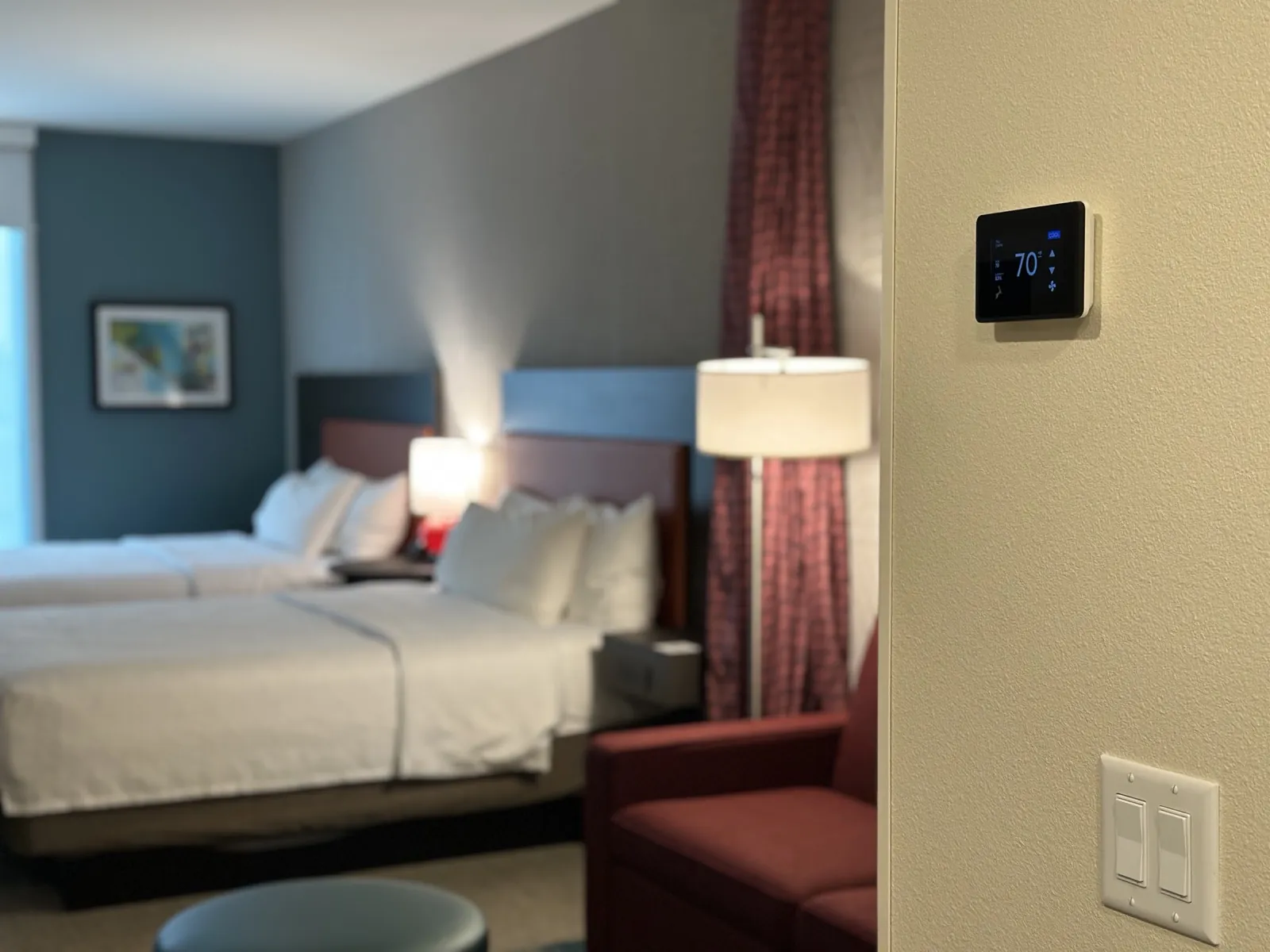 GridRabbit thermostat and switches installed in a hotel room